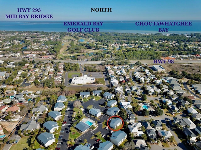 drone / aerial view featuring a residential view and a water view