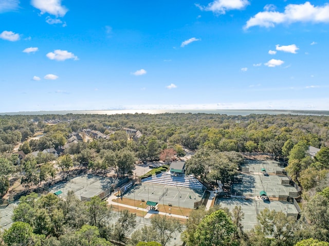 bird's eye view with a wooded view