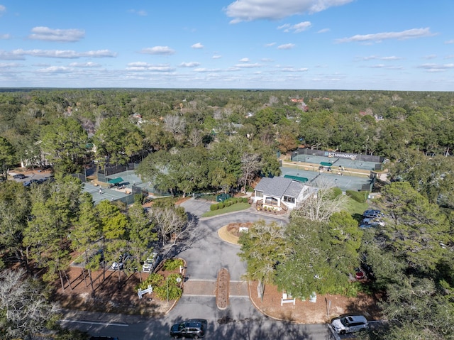 birds eye view of property with a view of trees