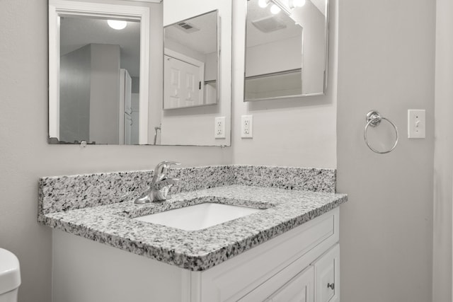 bathroom featuring visible vents and vanity