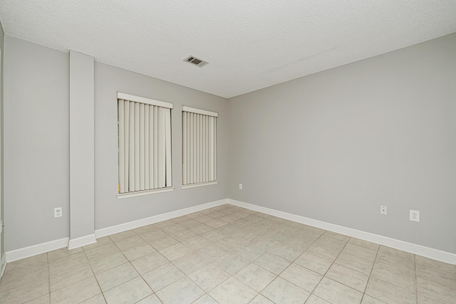 303 Southlake Ct Unit 303, Niceville, FL 32578 - unfurnished room featuring a textured ceiling and baseboards