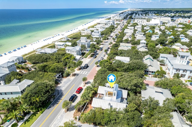 birds eye view of property with a view of the beach, a residential view, and a water view