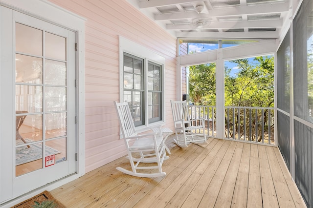 sunroom / solarium with lofted ceiling with beams