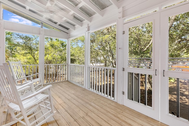 unfurnished sunroom featuring lofted ceiling