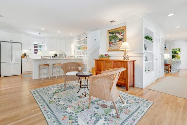 sitting room featuring recessed lighting, visible vents, and light wood-style floors