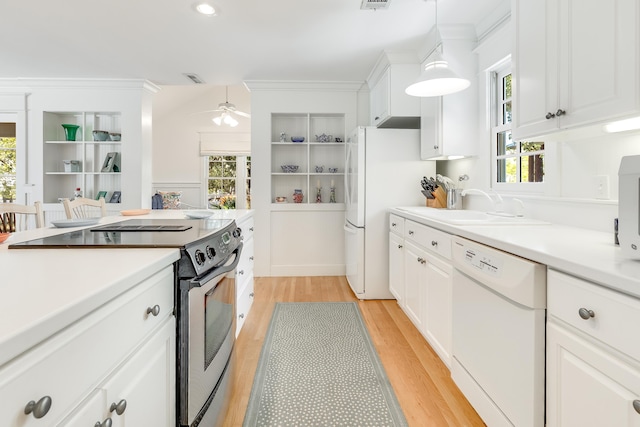 kitchen with white cabinetry, white appliances, light countertops, and light wood-type flooring