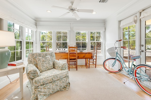 sunroom with visible vents and a ceiling fan