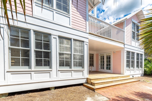 exterior space with french doors and a balcony