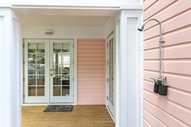 view of exterior entry featuring french doors