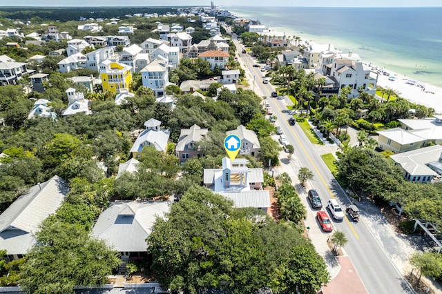 bird's eye view with a view of the beach, a water view, and a residential view