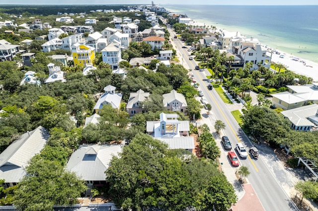 aerial view with a residential view, a water view, and a view of the beach