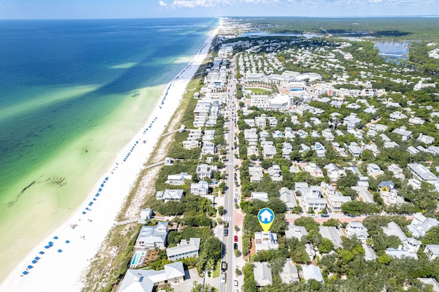 drone / aerial view featuring a view of the beach and a water view