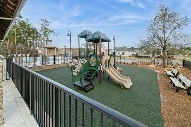 community play area featuring fence