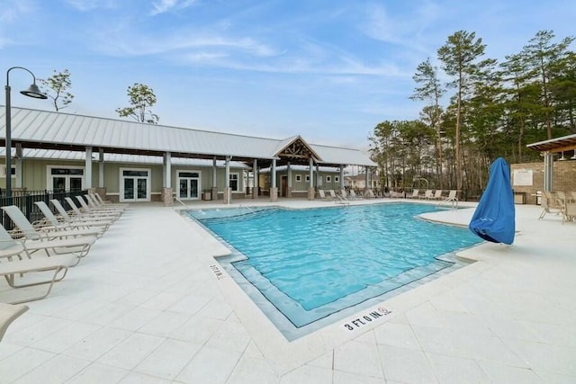 pool featuring a patio and french doors