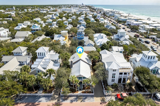 birds eye view of property with a water view, a residential view, and a view of the beach