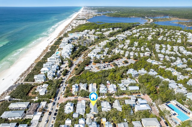 bird's eye view featuring a water view, a residential view, and a beach view