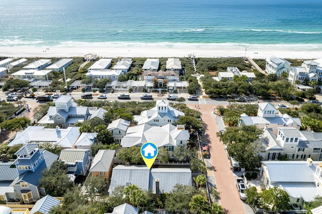 aerial view with a beach view, a residential view, and a water view