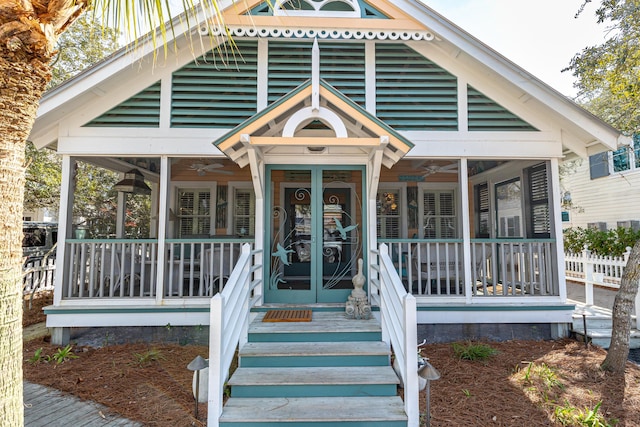 exterior space featuring a ceiling fan, french doors, and a porch