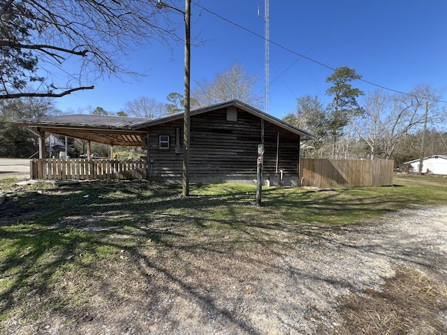 view of home's exterior featuring fence