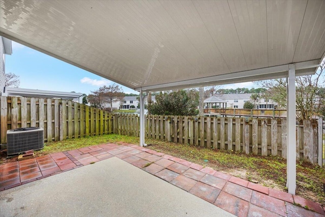 view of patio / terrace with a fenced backyard and central AC