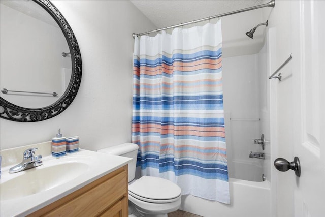 full bath featuring toilet, shower / tub combo with curtain, a textured ceiling, and vanity