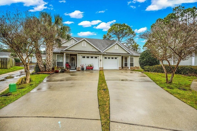 view of front facade with a garage and concrete driveway