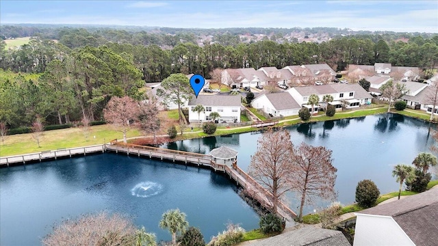 drone / aerial view featuring a residential view and a water view