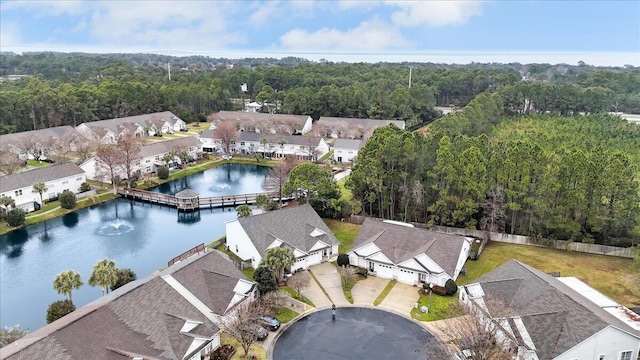 drone / aerial view with a residential view and a water view