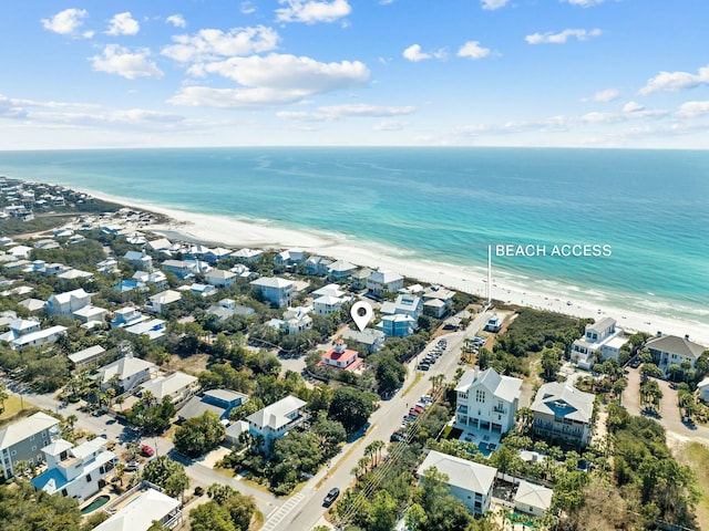 bird's eye view with a view of the beach, a water view, and a residential view