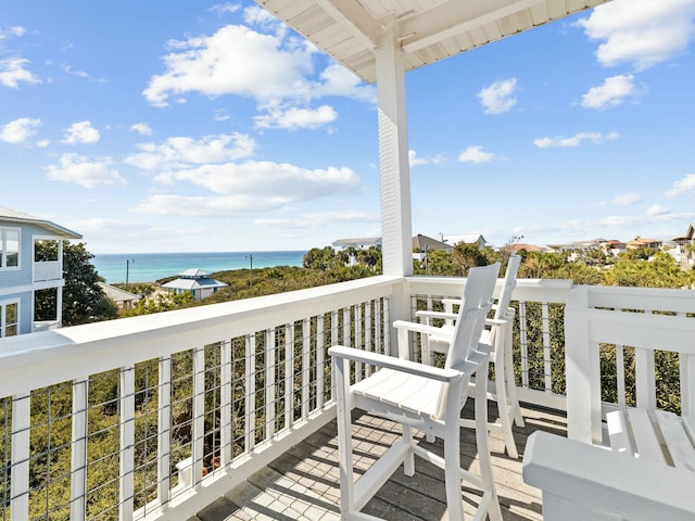 balcony featuring a water view