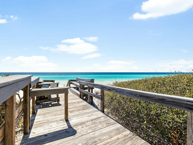 exterior space featuring a water view and a view of the beach