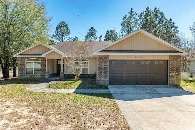 view of front of home with brick siding, roof with shingles, concrete driveway, a front lawn, and an attached garage