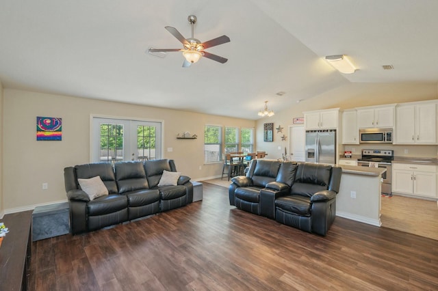 2908 Azalea Ave, Crestview, FL 32539 - living area with vaulted ceiling, ceiling fan with notable chandelier, baseboards, dark wood-type flooring, and visible vents