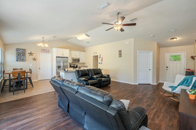 2908 Azalea Ave, Crestview, FL 32539 - living area featuring dark wood-style floors, ceiling fan with notable chandelier, baseboards, lofted ceiling, and visible vents