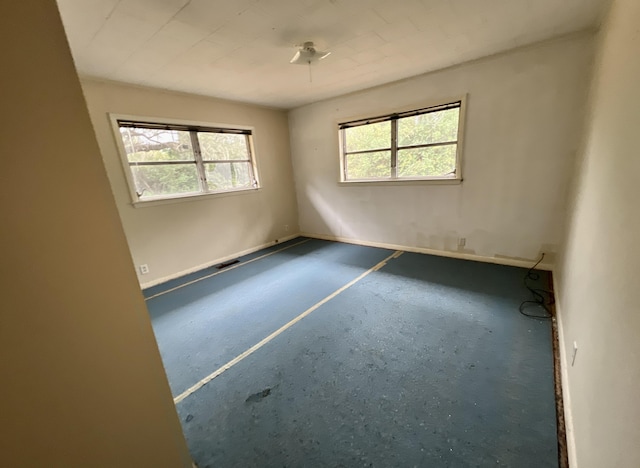 unfurnished room featuring a wealth of natural light