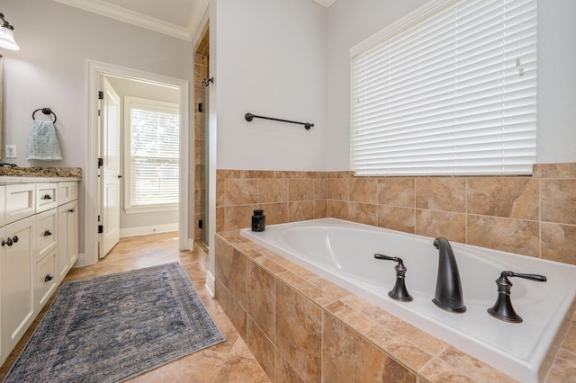 full bathroom featuring tile patterned flooring, a garden tub, vanity, a stall shower, and crown molding