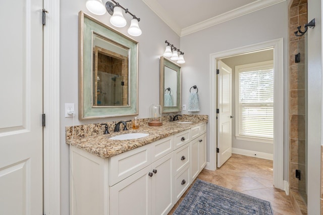 bathroom featuring double vanity, crown molding, a sink, and tile patterned floors