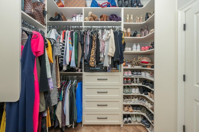 walk in closet featuring light tile patterned floors