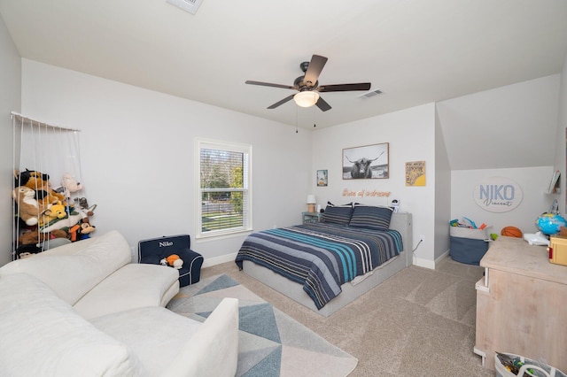 bedroom featuring a ceiling fan, visible vents, light carpet, and baseboards