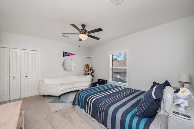 bedroom featuring ceiling fan, carpet floors, a closet, and visible vents