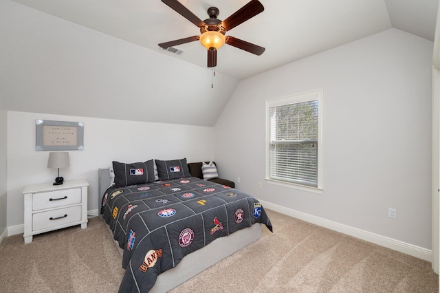 carpeted bedroom featuring ceiling fan, visible vents, baseboards, and vaulted ceiling