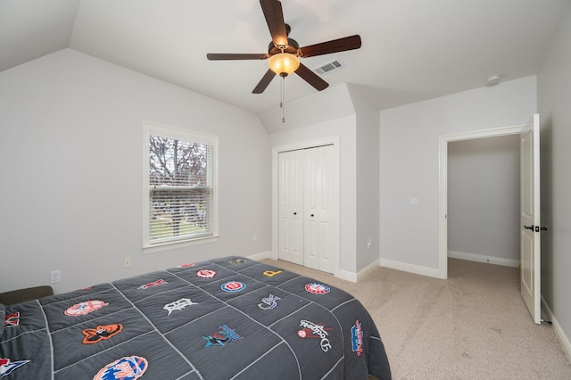 unfurnished bedroom featuring lofted ceiling, carpet, visible vents, and baseboards