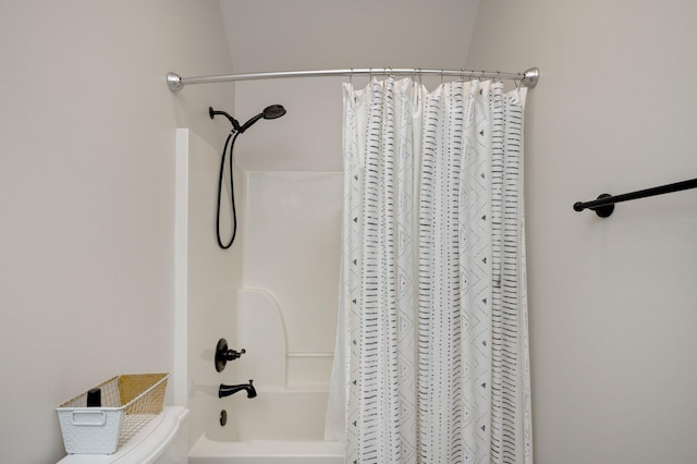 bathroom with toilet and shower / bathtub combination with curtain