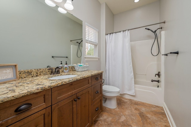 bathroom with toilet, shower / bath combo, vanity, and baseboards