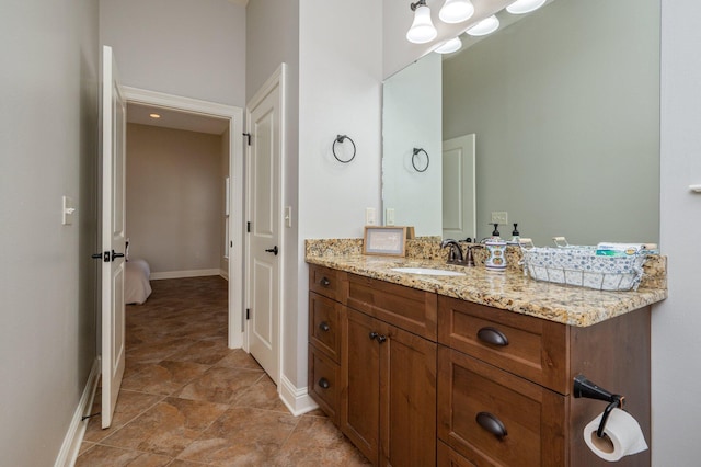 bathroom featuring vanity and baseboards