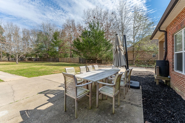 view of patio featuring outdoor dining space and a fenced backyard