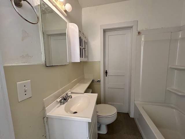 full bath featuring vanity and toilet