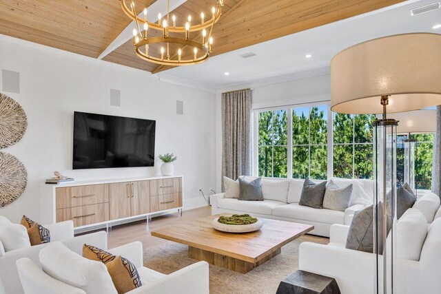 living area featuring a chandelier, light wood-type flooring, and baseboards