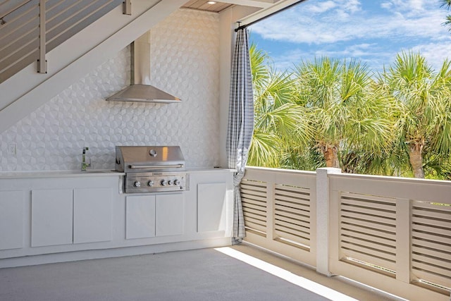 view of patio featuring grilling area, an outdoor kitchen, a balcony, and a sink