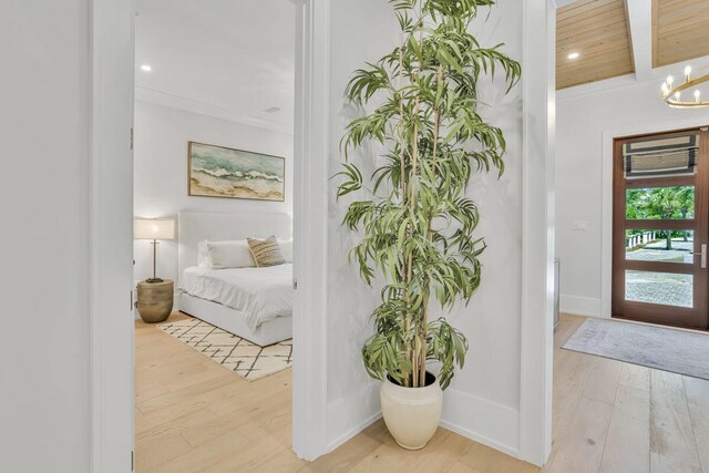 bedroom featuring wood finished floors, a chandelier, and recessed lighting